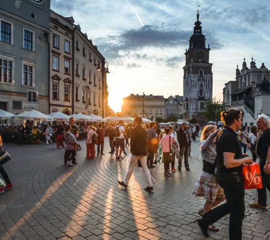 people walking on street near concrete buildings